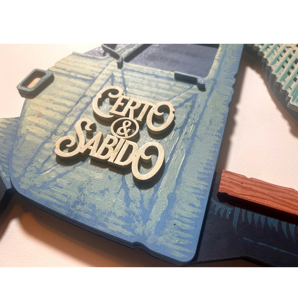 Detailed view of the original acrylic painting on layered wood "Certo & Sabido" by Mário Belém, highlighting the bold hand-painted typography, the intricate graphic elements, and the depth of the overlapping wood layers.