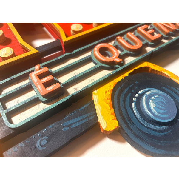 Detailed view of the original acrylic painting on layered wood "Essa é que é essa" by Mário Belém, highlighting the bold hand-painted typography, the layered wooden composition, and the vibrant graphic details