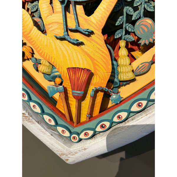 Detail view of Mário Belém wood sculpture interior showing painted characters and aerosol line art