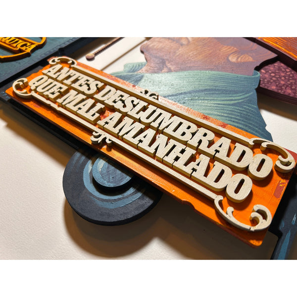 Detailed view of the original acrylic painting on layered wood "Quiçá" by Mário Belém, featuring the central typography, the hand-painted details on the different wood levels, and the vibrant palette of the artist's signature style.