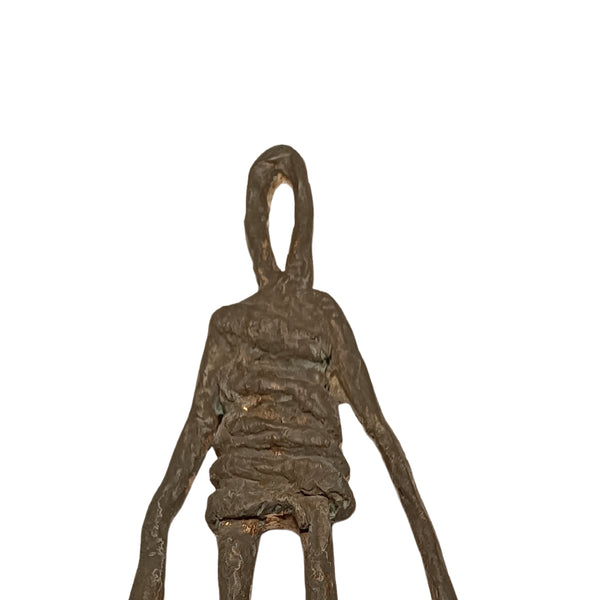Close-up detail of the bronze patina and texture of the sculpture "Last Man Standing" by RAM.